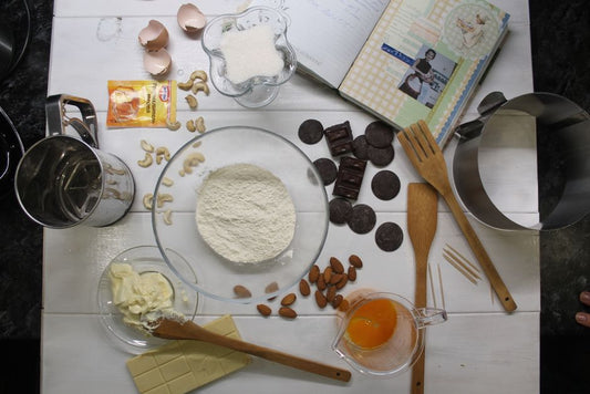 Aerial view of baking ingredients and tools ready for cooking.