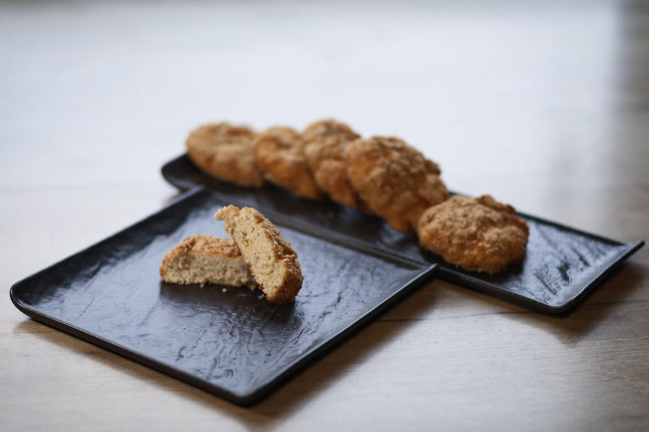 Delicious homemade cookies displayed on black serving plates, highlighting a cozy snack moment.