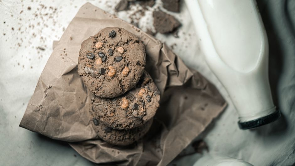 Tasty chocolate chip cookies with milk captured in a cozy, homemade setting.