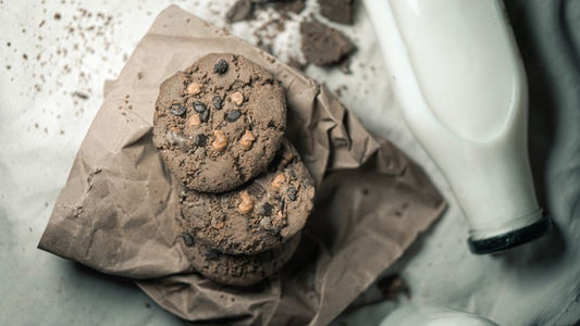 Tasty chocolate chip cookies with milk captured in a cozy, homemade setting.
