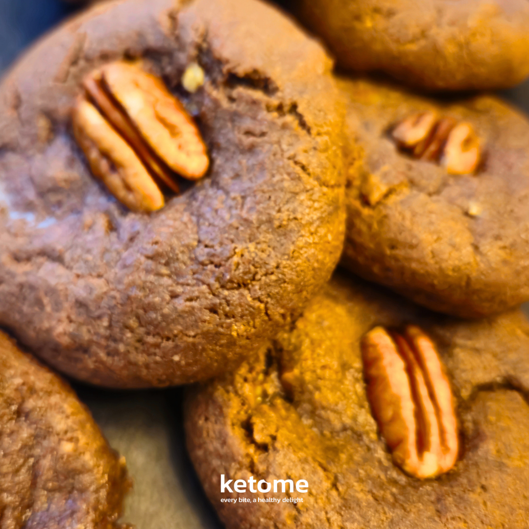 Close-up of pecan cookies with a brand logo in the corner.