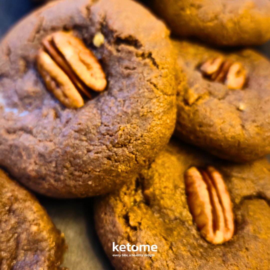 Close-up of chocolate cookies with pecans, branded 'ketome'.