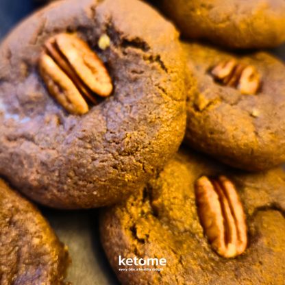Close-up of chocolate cookies with pecans, branded 'ketome'.